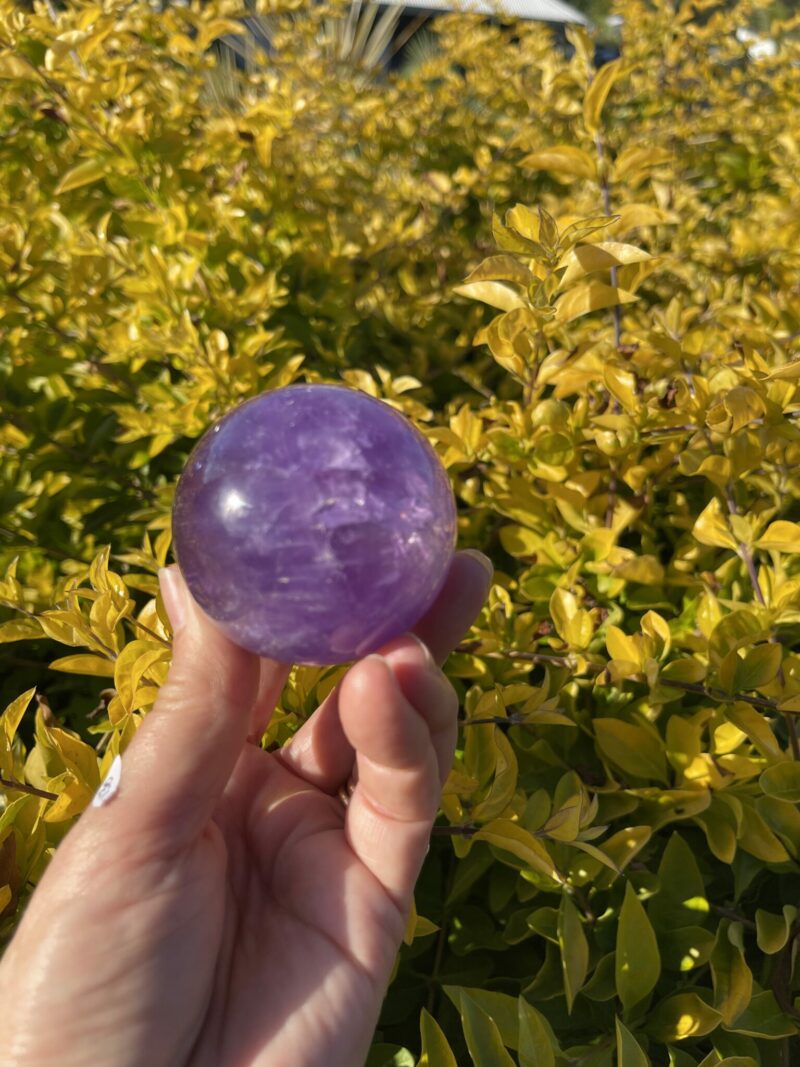 this is Happy Dark Amethyst Medium Sphere