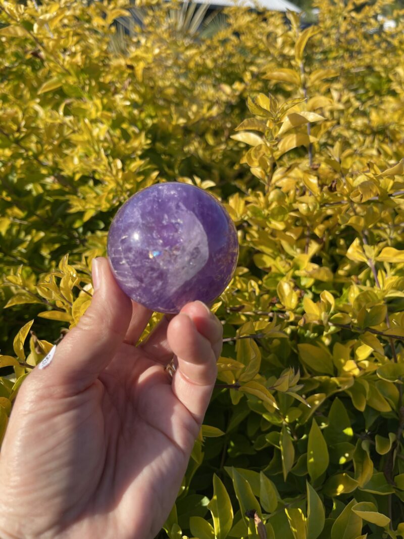 this is Happy Dark Amethyst Medium Sphere