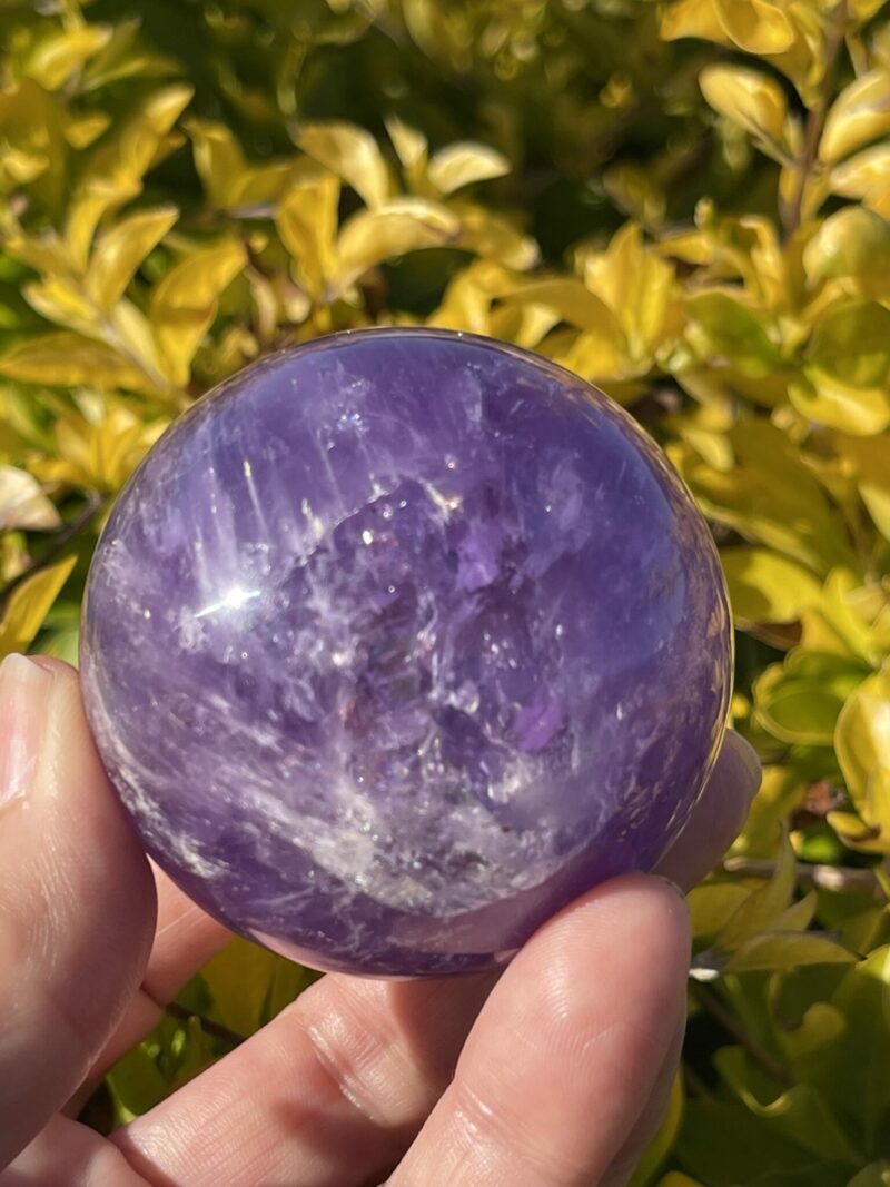 this is Happy Dark Amethyst Medium Sphere