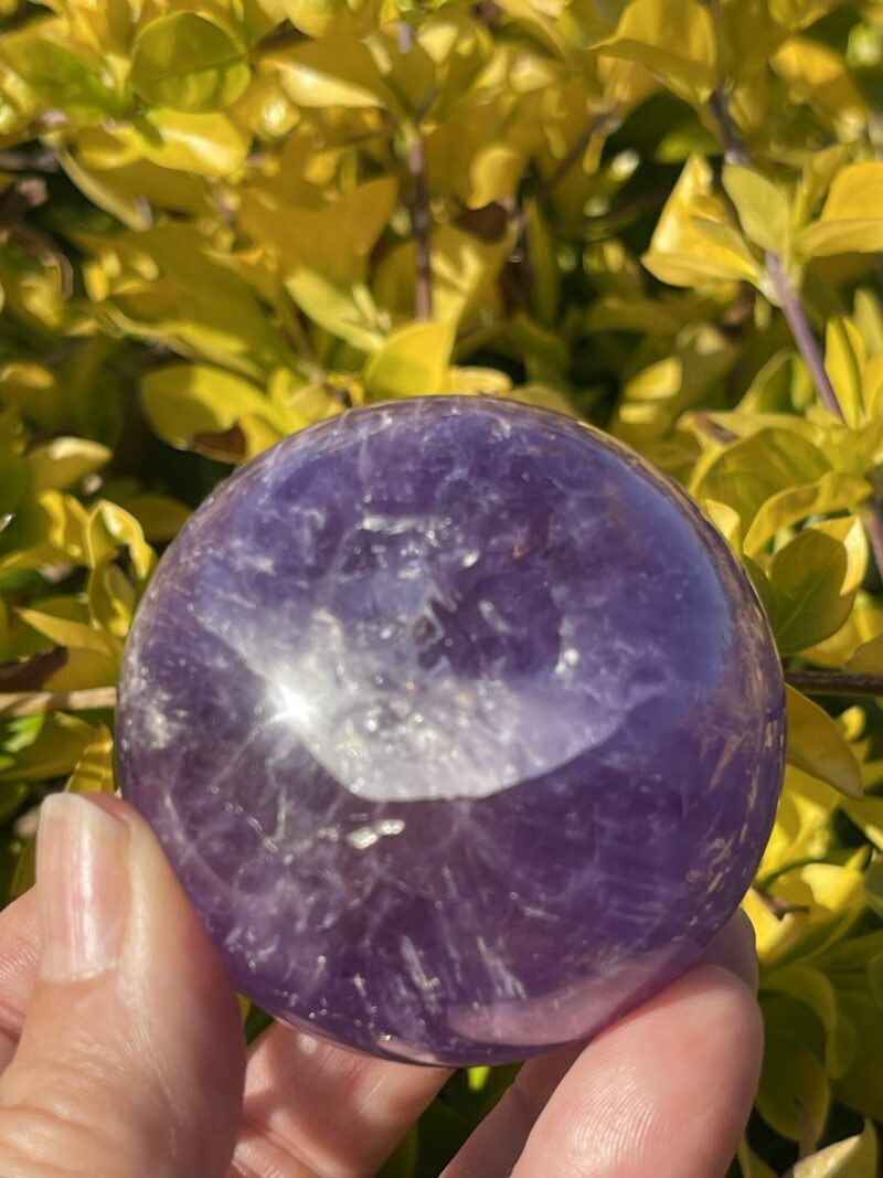 this is Happy Dark Amethyst Medium Sphere