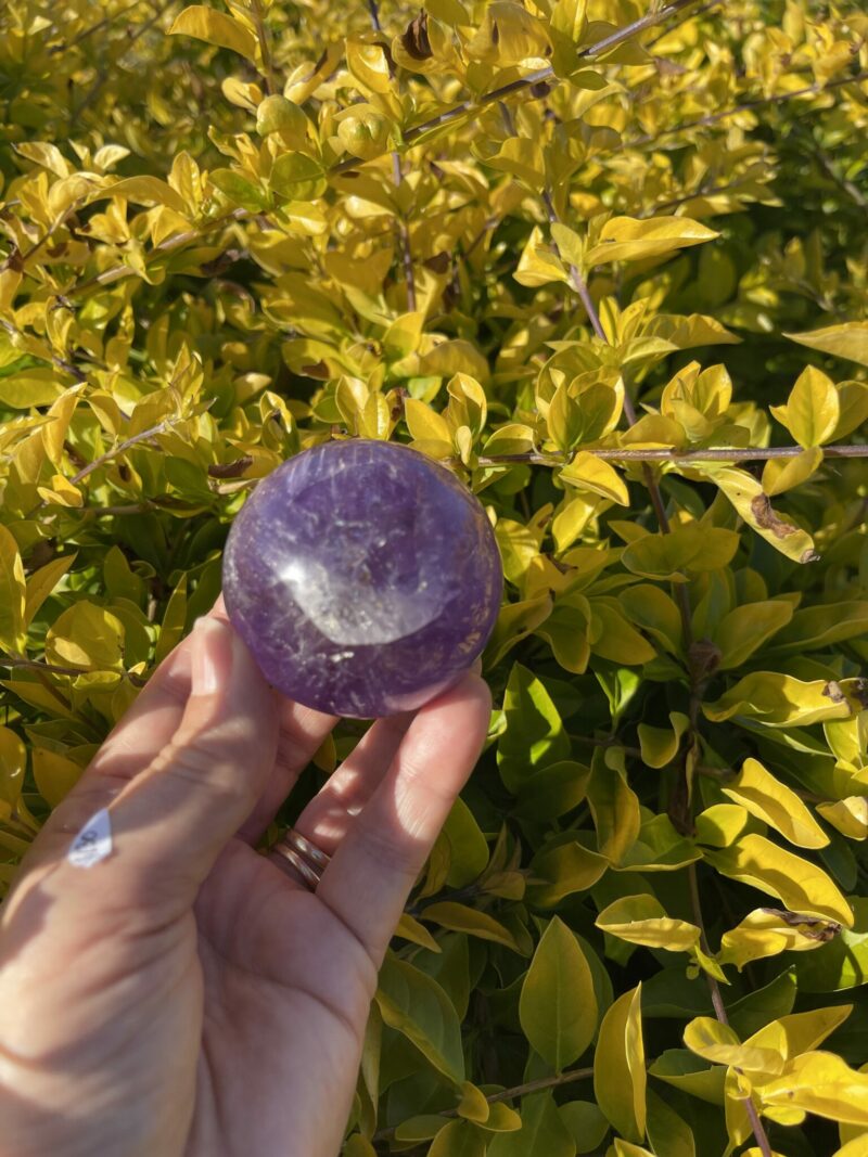 this is Happy Dark Amethyst Medium Sphere