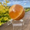 This is XL Orange Calcite World Within World Sphere 2.1kg