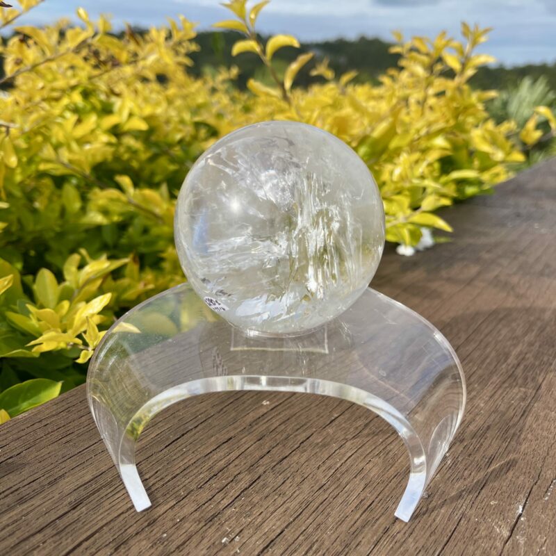 This is Clear Quartz Sphere with Earth Inclusions 72mm