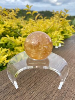 This is Mesmerizing Honey Calcite Sphere 62mm