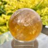 This is Mesmerizing Honey Calcite Sphere 62mm