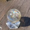 This is Rainbow-Filled Light Smoky Quartz Sphere 4cm