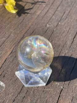 This is Rainbow-Filled Light Smoky Quartz Sphere 4cm