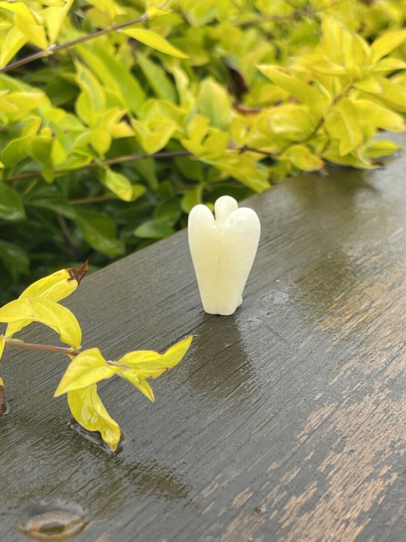 This is Mini Yellow Calcite Pocket Angel of Positivity - 3.5cm