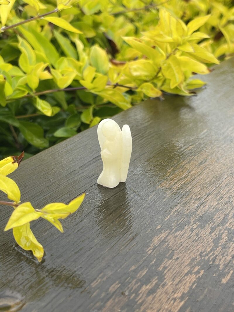 This is Mini Yellow Calcite Pocket Angel of Positivity - 3.5cm