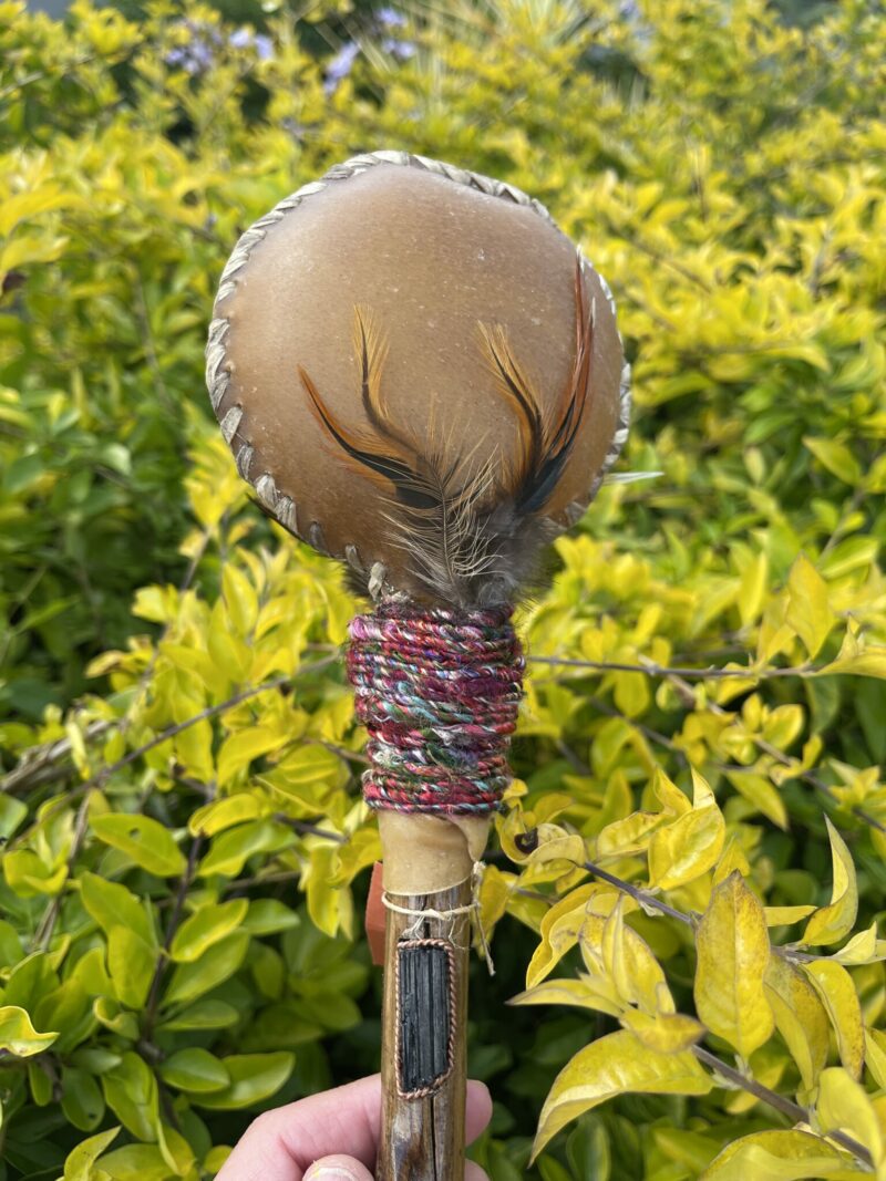 This is Ceremonial Goat Hide Rattle with Black Tourmaline (30cm)