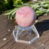 This is Rhodochrosite Sphere - Heart-Centered Harmony (3cm)