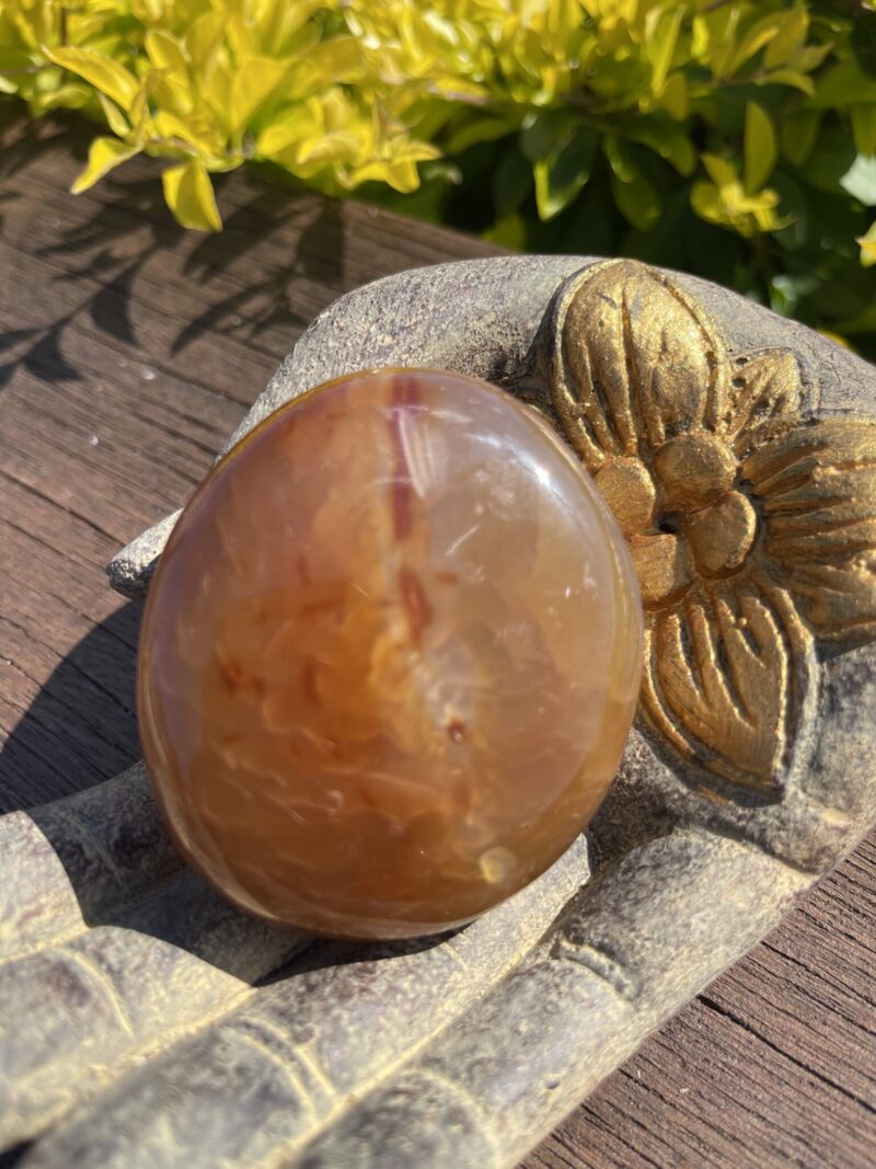 this is Fiery Carnelian Palm Stone for Energy