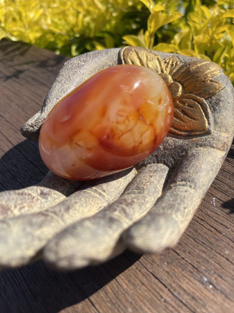 this is Radiant Carnelian Palm Stone for Joy