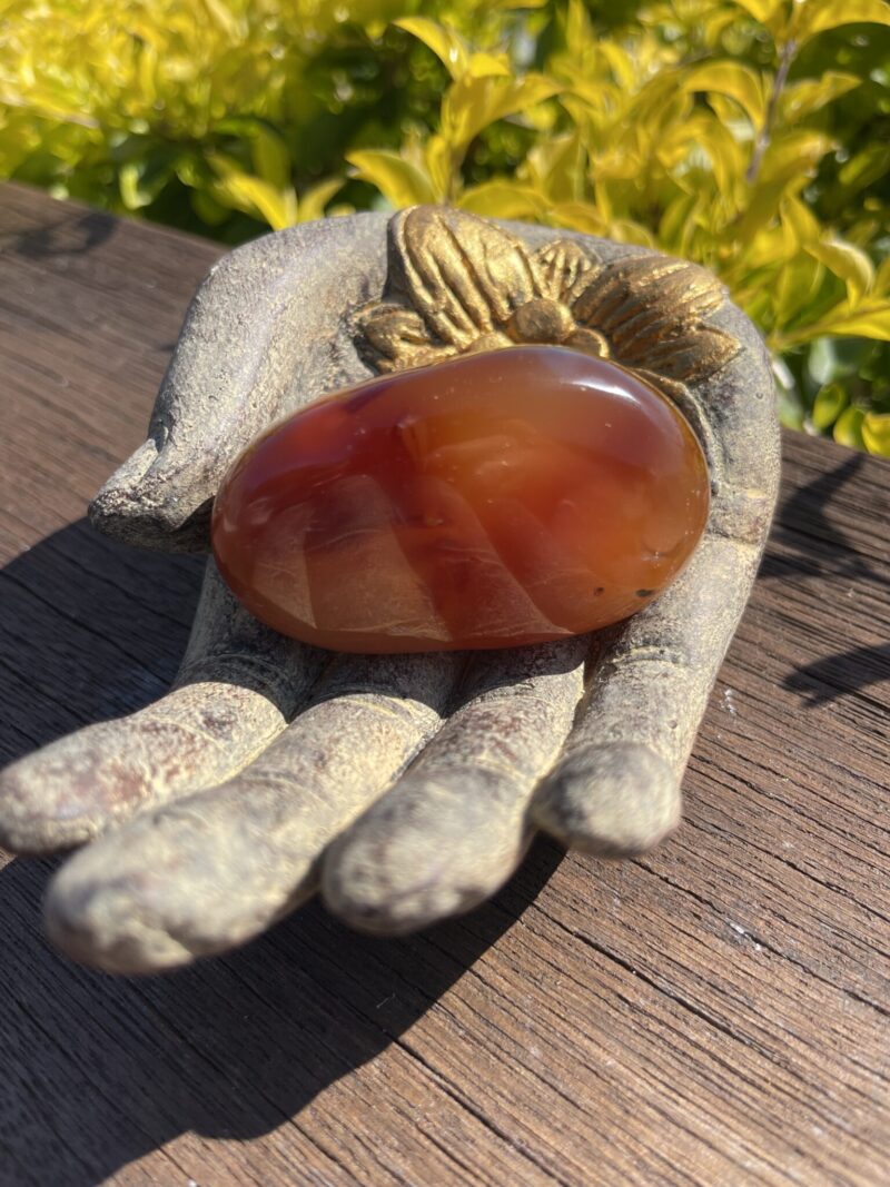 This is Grounding Carnelian Palm Stone