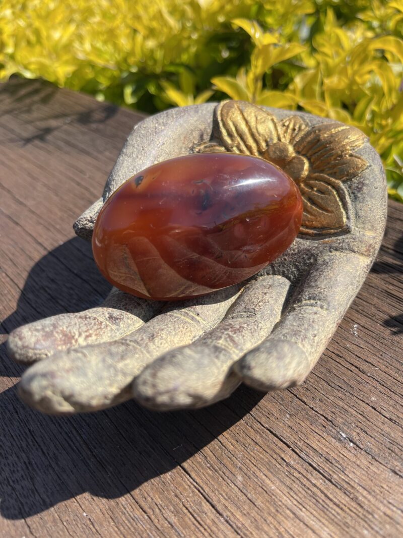 This is Grounding Carnelian Palm Stone