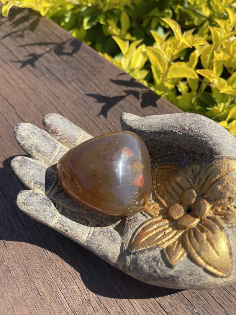 This is Uplifting Carnelian Palm Stone