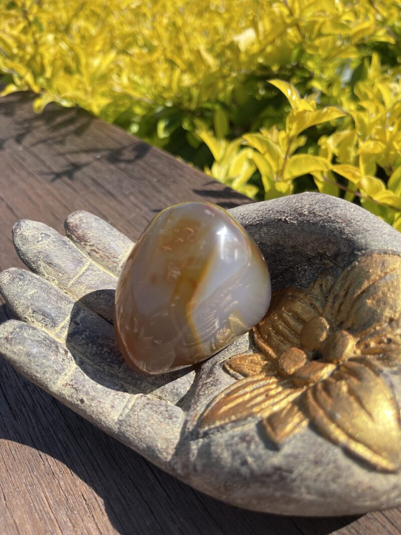 This is Uplifting Carnelian Palm Stone