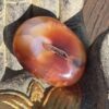 This is Carnelian Palm Stone for Motivation and Joy