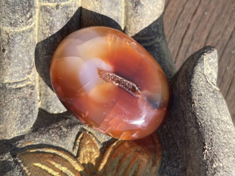 This is Carnelian Palm Stone for Motivation and Joy