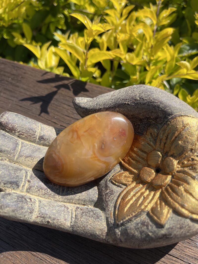 This is Carnelian Palm Stone for Balance and Focus