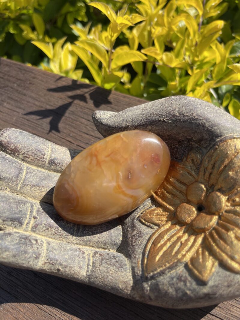 This is Carnelian Palm Stone for Balance and Focus