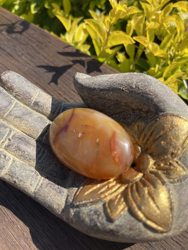 This is Carnelian Palm Stone for Balance and Focus