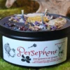 This is Embrace the Dual Nature of Persephone with Our Queen of the Underworld and the Goddess of Spring Candle