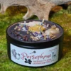 This is Embrace the Dual Nature of Persephone with Our Queen of the Underworld and the Goddess of Spring Candle