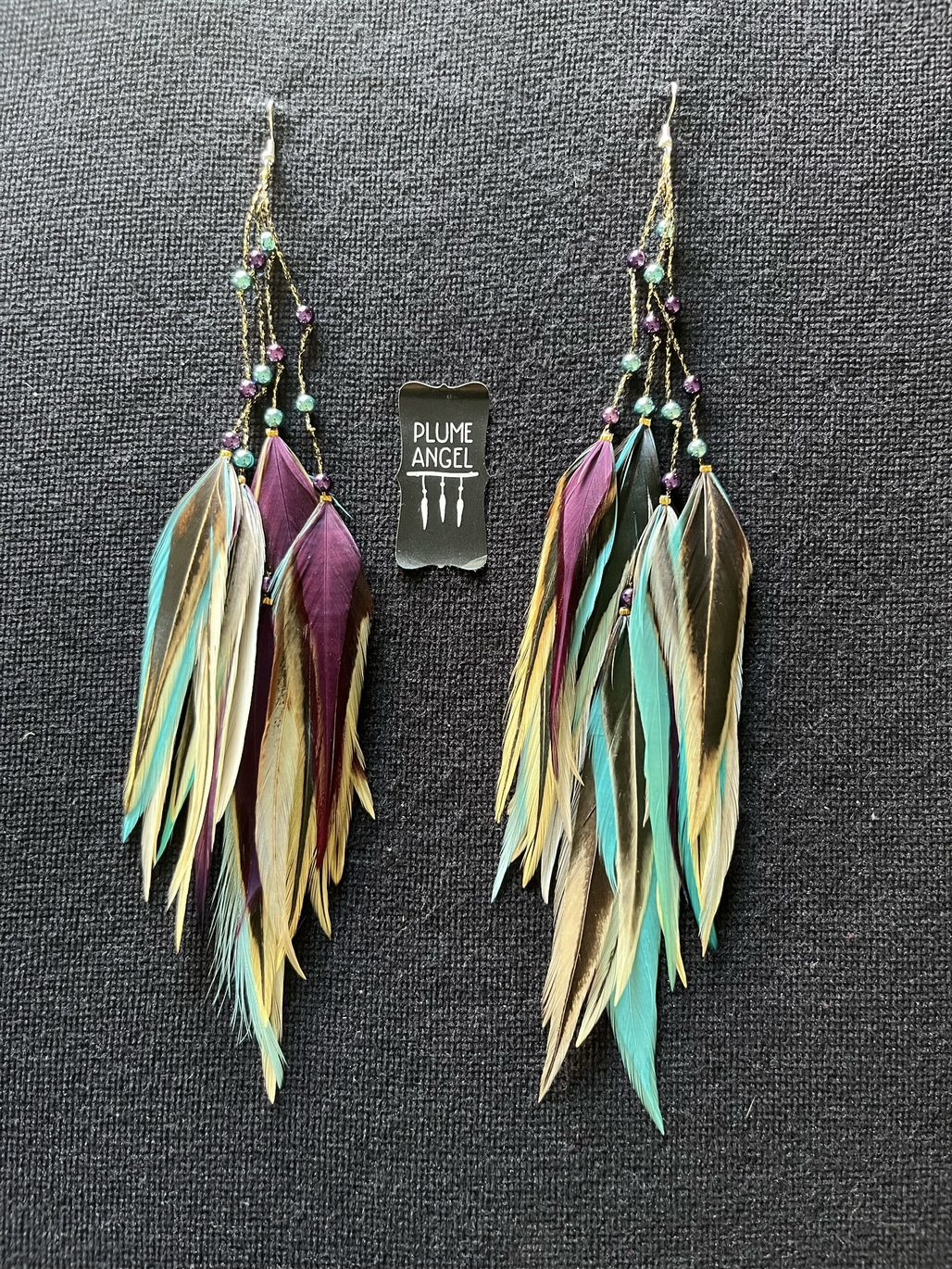 These are Purple and Turquoise Freedom Feather Earrings – Vibrant Elegance and Uplifting Energy