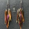 These are Purple Beads on Silver String Feather Earrings – Mystical Elegance in Every Detail