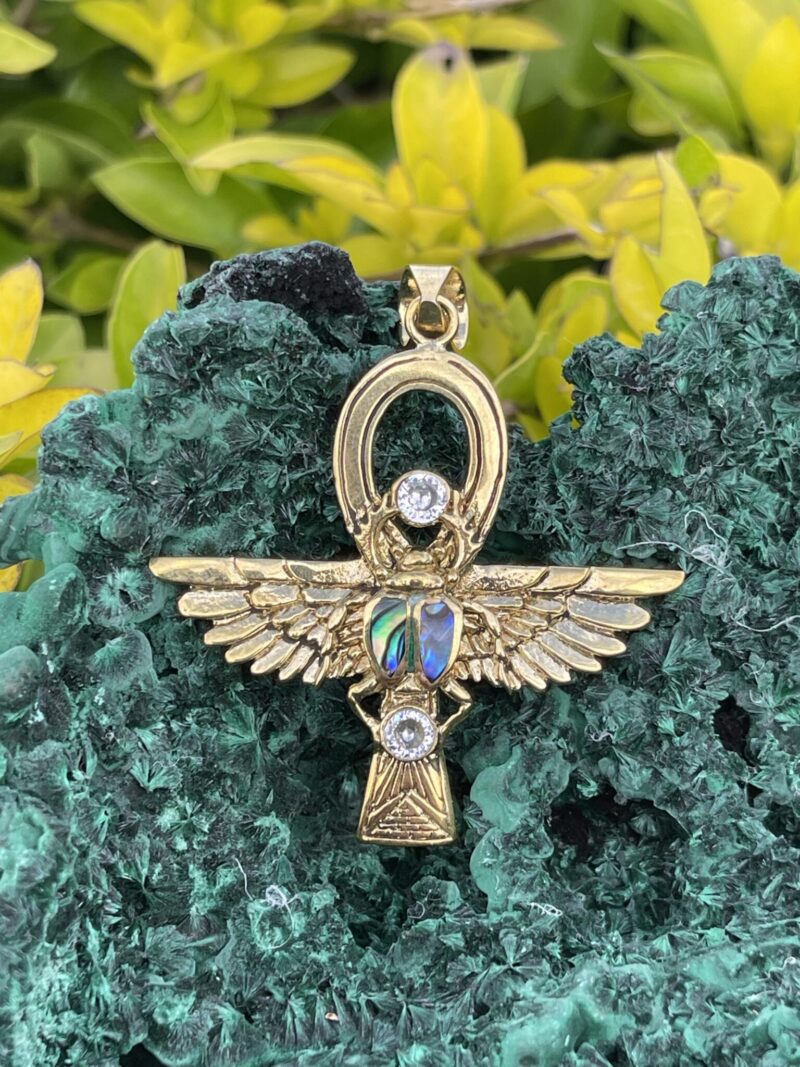 This is Brass Ankh with Wings of Isis, Scarab, Abalone Accents, and Clear Quartz