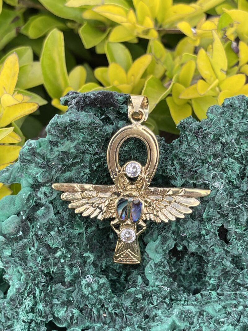 This is Brass Ankh with Wings of Isis, Scarab, Abalone Accents, and Clear Quartz