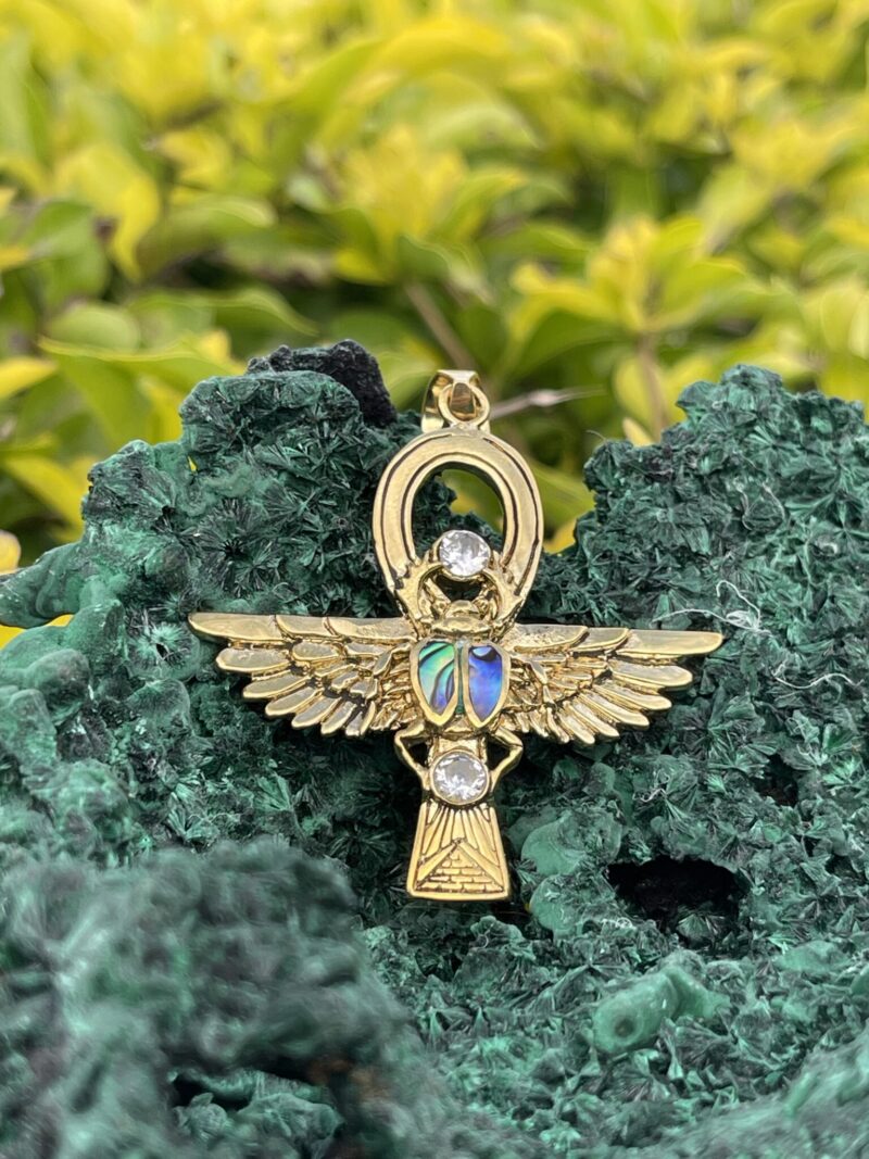 This is Brass Ankh with Wings of Isis, Scarab, Abalone Accents, and Clear Quartz