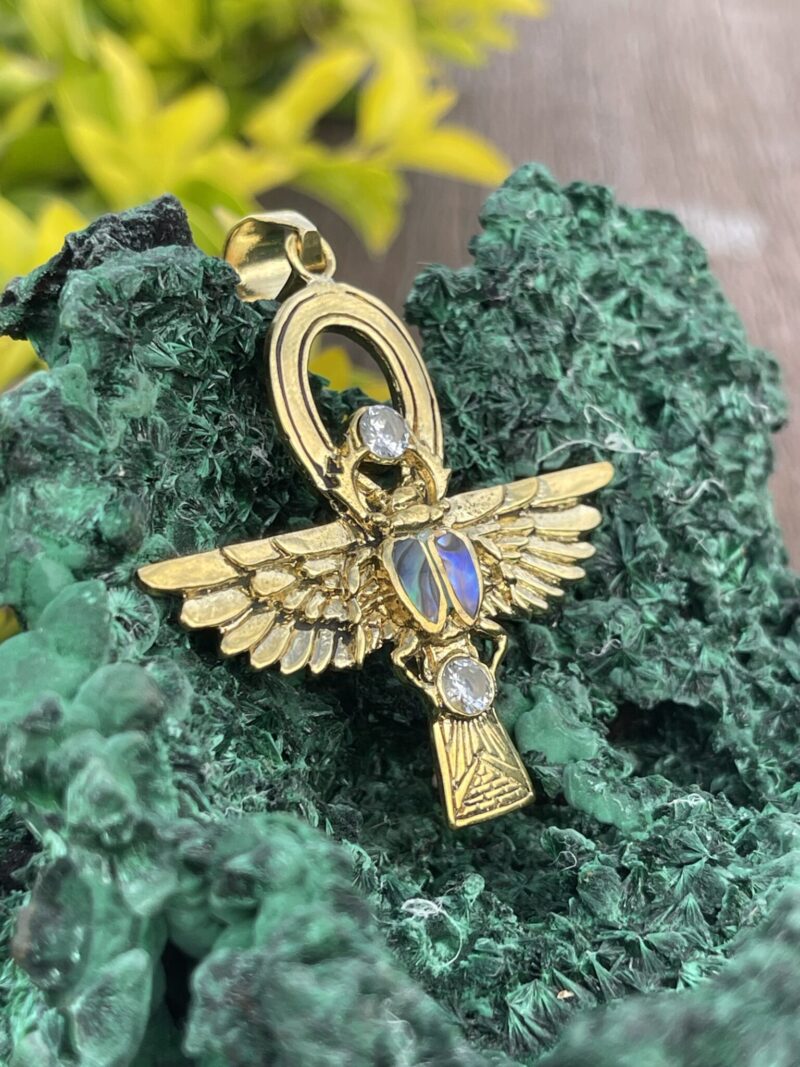 This is Brass Ankh with Wings of Isis, Scarab, Abalone Accents, and Clear Quartz