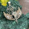 This is Brass and Silver Hypercube Raven Skull Wing Pendant