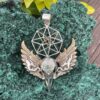 This is Brass and Silver Hypercube Raven Skull Wing Pendant