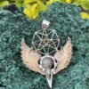 This is Brass and Silver Hypercube Raven Skull Wing Pendant