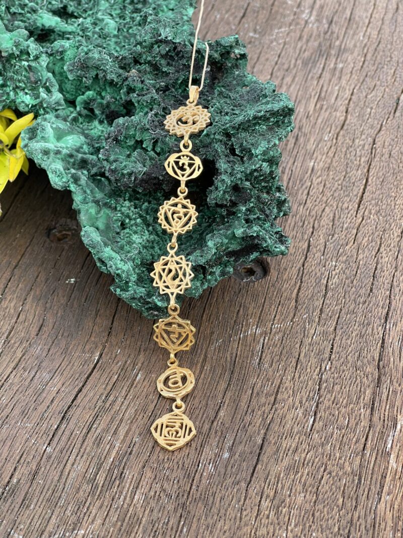 This is Elevate Energy with  Brass 7 Chakra Symbol Necklace