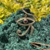 This is stunning Brass Eye of Horus Pendant with Garnet Eye