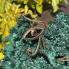 This is stunning Brass Eye of Horus Pendant with Garnet Eye