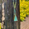 This is Sea Green Shell and Feather Crystal Bead Necklace