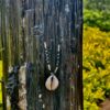 This is Elegant Black and Clear Beads Cowrie Shell Necklace