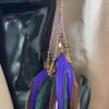 These are Chantire Natural and Purple Feather Earrings