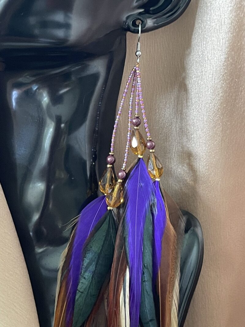 These are Chantire Natural and Purple Feather Earrings