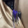 These are Purple Freedom Feather Earrings – Embrace Grace and Liberation