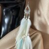 These are Blond Pastel Turquoise Feather Earrings – Elegance in Length and Soft Hues