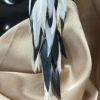 These are Peacock Princess Black and White Feather Earrings