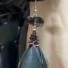 These are Raw Smokey and Garnet Mystical Feather Earrings