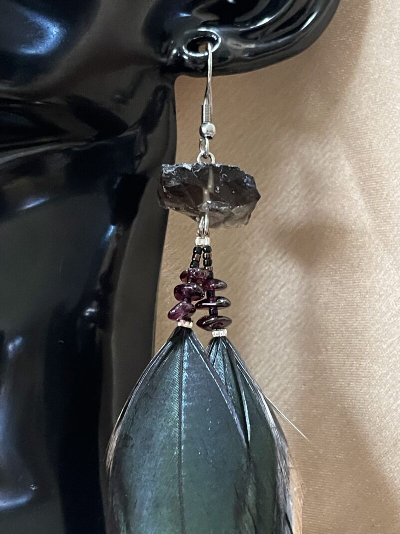 These are Raw Smokey and Garnet Mystical Feather Earrings