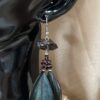 These are Raw Smokey and Garnet Mystical Feather Earrings